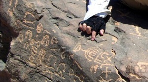 Arab Archeologist cannot account for the menorah petroglyphs on the pile of rocks below Mount Horeb the real Mount Sinai, across the Red Sea, from the Sinai Peninsula. Here is where Moses tended  sheep and saw the angel in the burning bush.